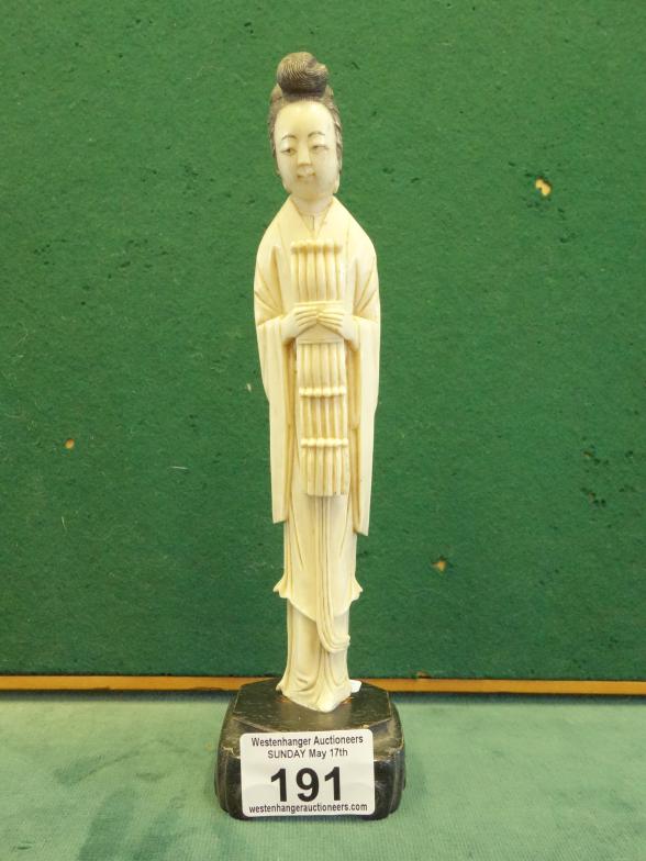 Edwardian period carved ivory figurine of a Geisha Girl, carving 7.5" tall on hardwood black base,