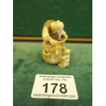 Signed Netsuke, Bearded Man, and small man standing on bucket, 2" tall