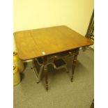 19c mahogany Pembroke table on turned and tapering supports with brass castors, 2 drop sides and 1