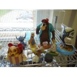 Collection of small Disney figurines each one from the classic Walt Disney collection including