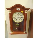 Modern 8 day clock modelled in the antique style Westminster chiming by Rapport, working order