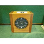 David Linley, a mahogany travel clock with black dial, chrome back marked Linley, dial marked Linley