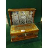 Good quality late 19 th century oak Arts & Crafts inspired 3 bottle Tantalus, the rear section