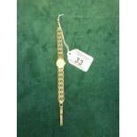 Delicate Ladies 9ct gold gate link bracelet oval faced wrist watch by Tissot, 9ct gold strap and