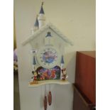 Novelty Cuckoo style wall clock modelled as Mickey and Minnie Mouse and various Disney figures,