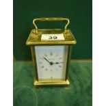 Brass carriage clock by Bayard, 4.5" tall with an 8 day movement, wind action to rear, a 9 jewel