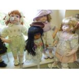 Collection of 8 modern porcelain headed Dolls each one in period style dress, sizes vary from 12"