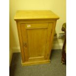 Pine 19c cupboard with a single door to the front, 36" tall 14" deep on a plinth base