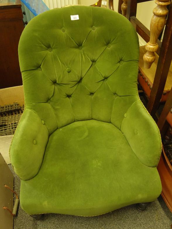 Victorian green button backed arm chair with horse hair seating and back on turned supports