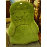 Victorian green button backed arm chair with horse hair seating and back on turned supports