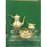Matched solid silver 3 piece Classical style tea service comprising large water jug, tea pot and