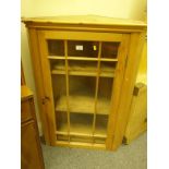 Mid-19c pine corner cabinet 3'6 tall 18" deep 20" wide approx with a single glazed door to the front