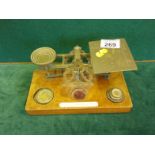 Vintage set of postage scales, with some weights, engraved Balance scale top on walnut base,