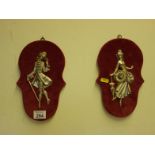 Pair of 1970's velvet wall plaques, each has a small silver figure of a man and lady in period