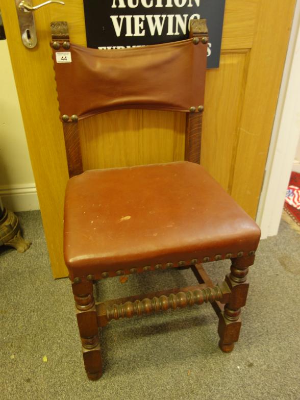 Set of 1920's Gothic style dining chairs with overstuffed seats and backs,