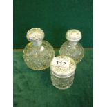 2 x similar cut glass and silver topped scent decanters both bottle shaped 3.5" tall and 4.5" tall