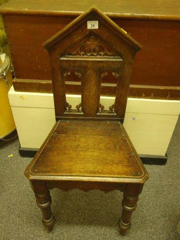 Oak Gothic hall chair on turned front supports