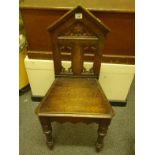 Oak Gothic hall chair on turned front supports