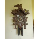 Black Forrest £ style Cuckoo Clock with twin weight movement, decorative case, 14" long x 10"