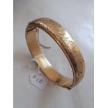 Rolled gold hinged bangle with engraved decoration