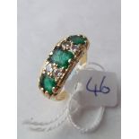 A seven stone emerald and diamond ring set in 18ct gold 7.4g