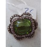 An attractive Edwardian peridot (cracked) brooch with fancy diamond border