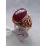 A heavy gold and red stone ring with chased shoulders 11g all in