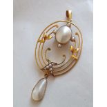 Stylish Art Nouveau pendant decorated with pearls within an oval body 2 ½” high