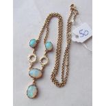 An opal four stone necklace with drop set in gold