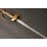 19th century, United States Army dress sword The cast brass hilt on etched steel blade. 37½in. (95¼