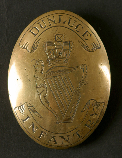 Circa 1790. Dunluce Infantry cross belt plate. A brass oval convex cross belt plate engraved to