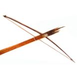 Hunting Bow and arrows, Dani tribe, West Papua, Indonesia A hunting bow with split cane bowstring