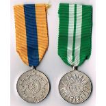 Garda Siochana pair of medals struck in sterling silver. A 22-year Long Service Medal, Dublin, 1972,