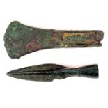 1st Millennium BC bronze implements A cast bronze palstave axe head and a bronze spear head. The axe