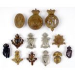 Military badges including Connaught Rangers, Earl of Ulster's, UVF etc. Mostly cap badges. Also