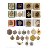 Circa 1914-1940s collection including military badges and Irish athletics Royal Dublin Fusiliers