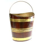 A George III brass-bound mahogany navette-shaped oyster bucket of coppered construction, with