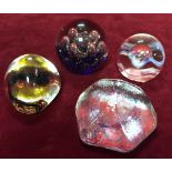 Four paperweights, Caithness, murano ETC.