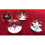 Four Selkirk glass paperweights