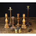 A Collection of Treen Candlesticks. A 19