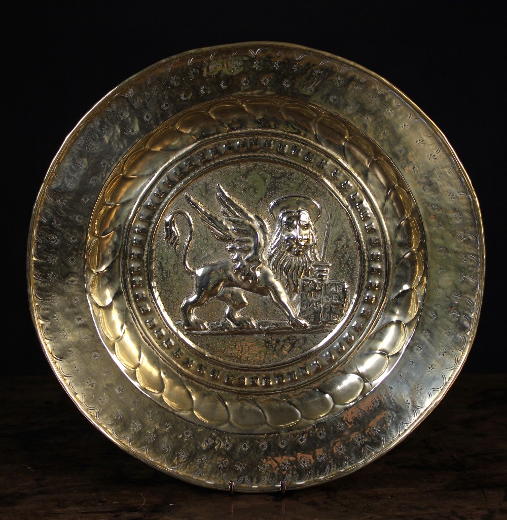 A 17th Century Brass Repoussé Alms Dish. - Image 2 of 2