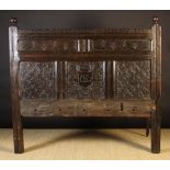 A 17th Century Panelled Oak Bed Head.  T