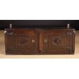 A  Charles II Oak Wall Cupboard. The two