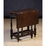 An Early 18th Century Oak Drop Leaf Tabl