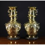 A Pair of Oriental Brass Vases. The balu