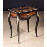 A 19th Century French Amboyna & Ebonised Dressing Table with decorative gilt mounts.