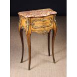A Fine Quality Louis XV Style Petite Commode with ormolu mounts.