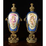 A Pair of 19th Century Porcelain Scent Bottles in the Sèvres Style with gilt metal mounts.