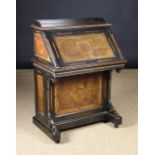 A Late 19th Century Continental Davenport Style Desk of ebony and burr walnut inlaid with