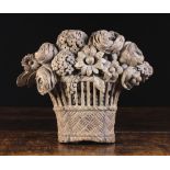 An 18th Century Relief Carving of a Basket of Flowers, 11 ins x 14 ins (28 cm x 36 cms).